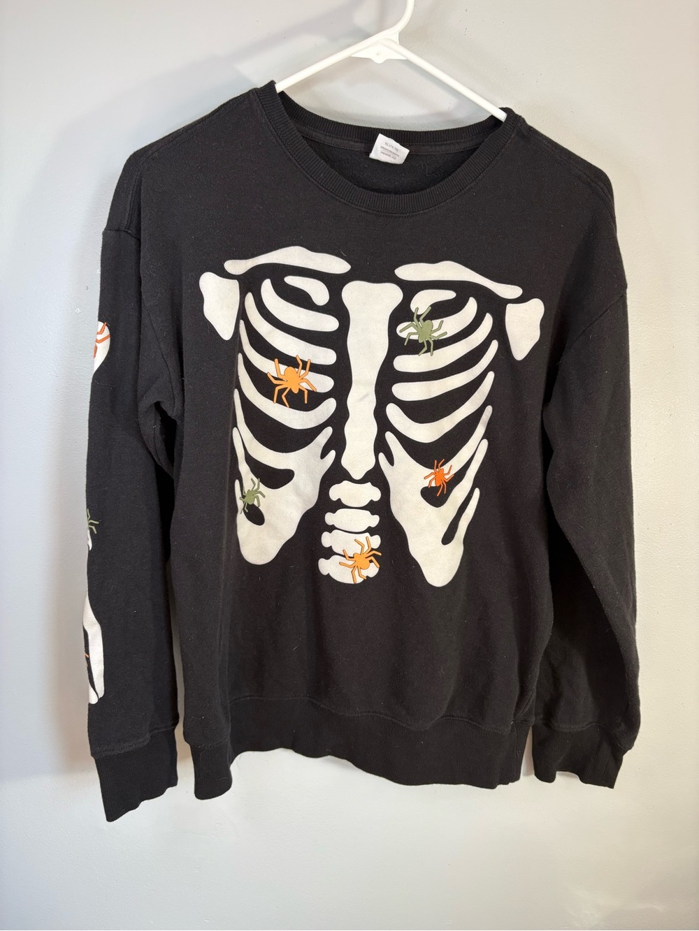 Black Crewneck Sweatshirt with White Skeleton Graphic and Orange/Green Accents